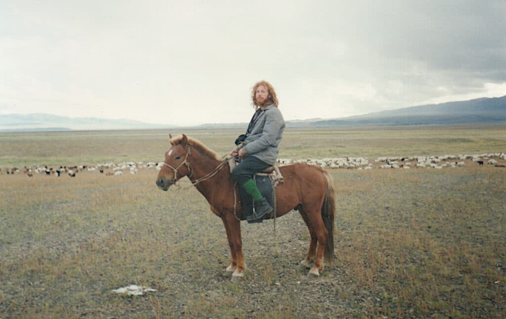 Chandman' Sum Tserendavaa's Ail Michael on his with herds of sheep and goats 1993